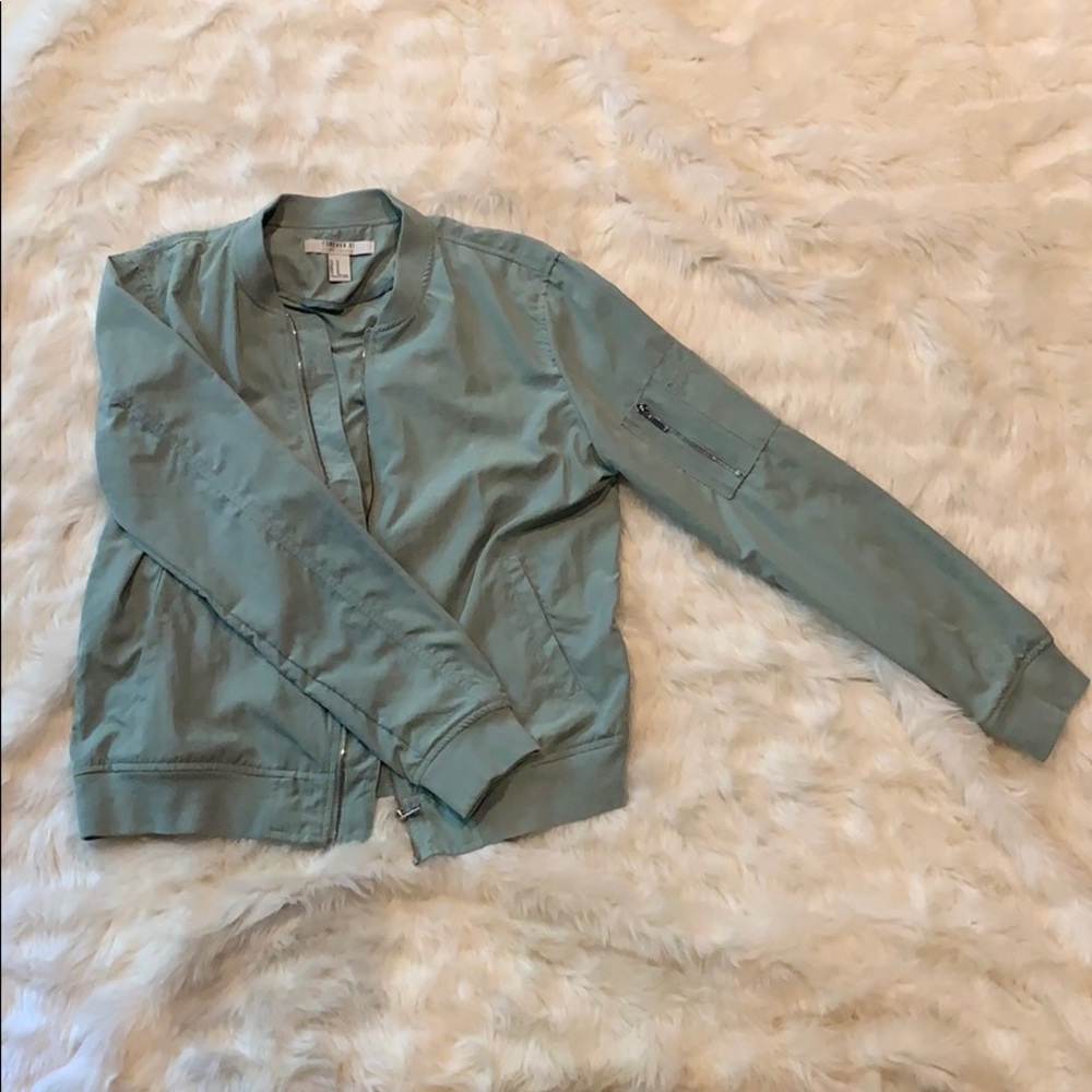 zip up teal jacket